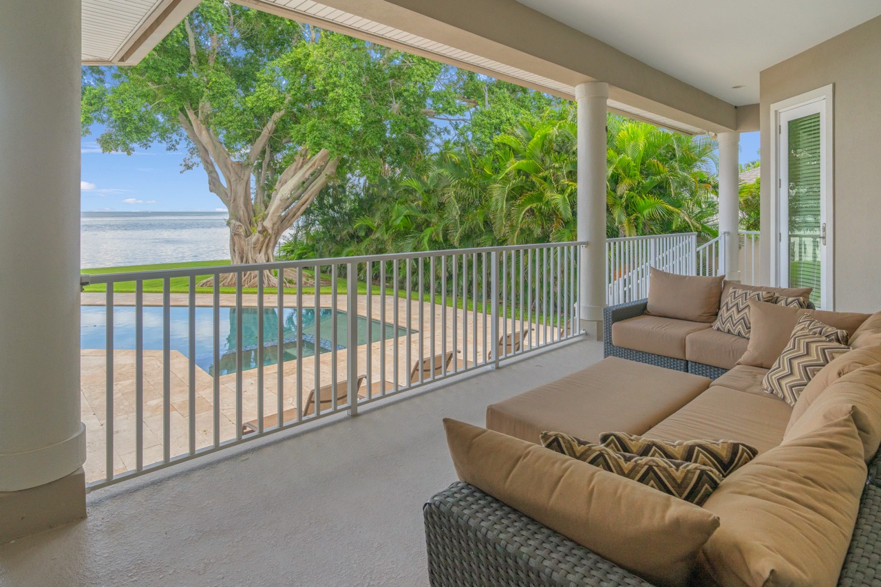 Covered balcony lounge above the pool